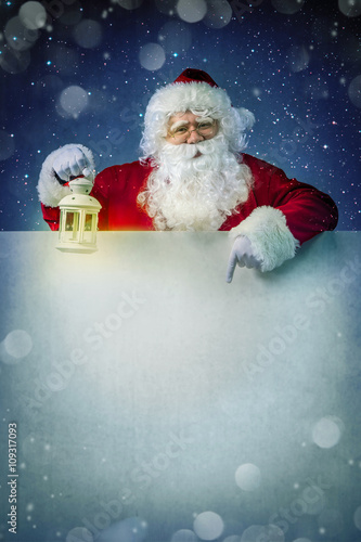 Santa claus with lantern photo