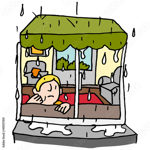 man sitting by a window on a rainy day