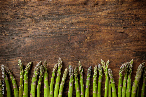 Fresh asparagus on wooden background