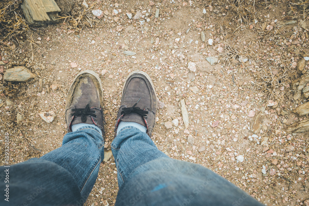 Looking down on feet, selective focus Looking down on feet, selective focus