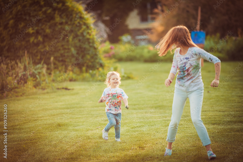 Mother and little daughter playing together Mother and little daughter playing together