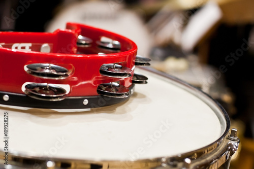 Fragment tambourine closeup lying on the drum