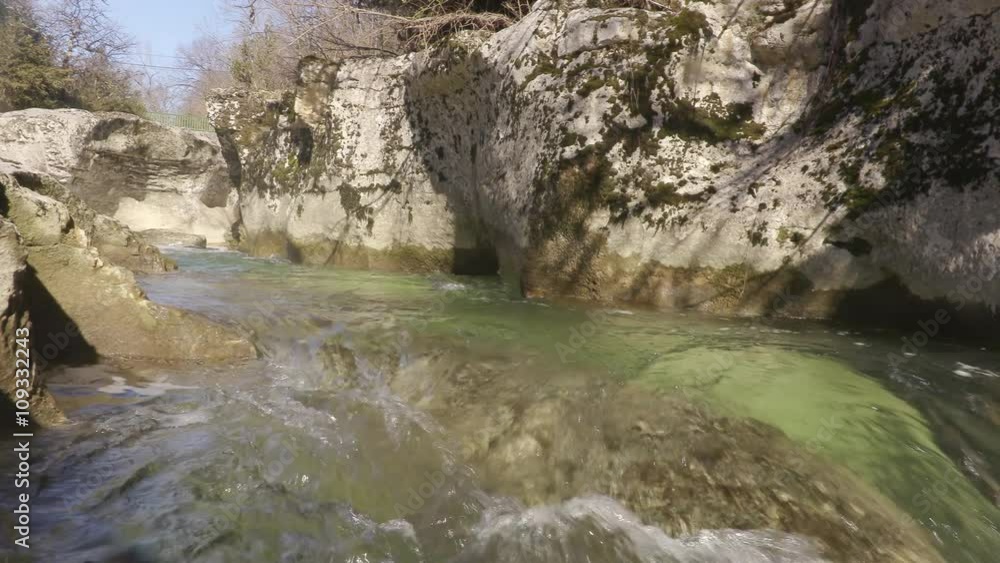 River flowing through rocks (limestone) in France River flowing through rocks (limestone) in France