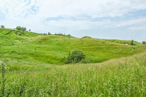 Picturesque green hills on a windy summer day