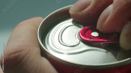 Opening of fizzy drink can photo