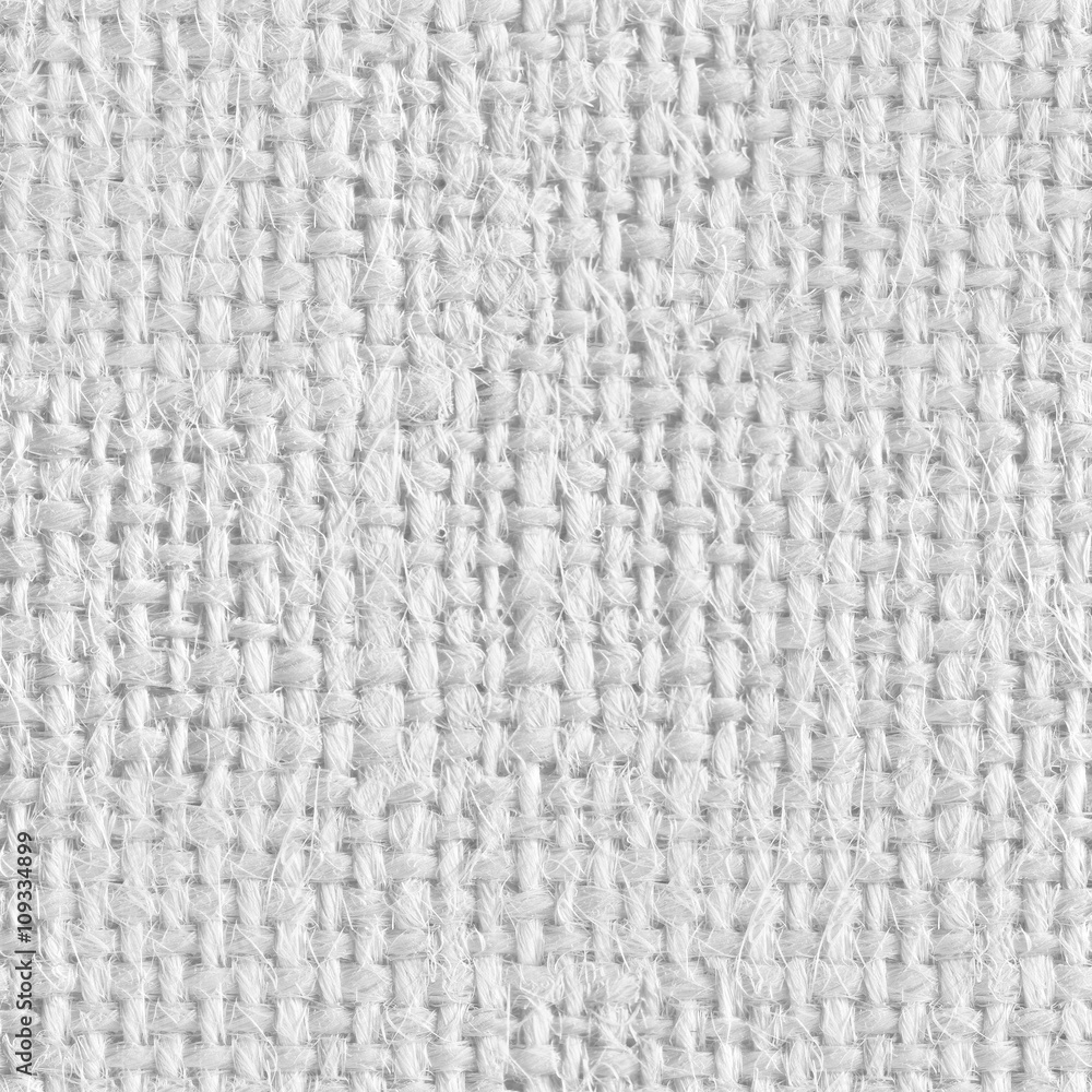 Background from gray coarse canvas. Seamless square texture. Tile ready. Background from gray coarse canvas. Seamless square texture. Tile ready.
