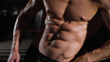Bodybuilder man with perfect abs, shoulders,biceps, triceps and chest .