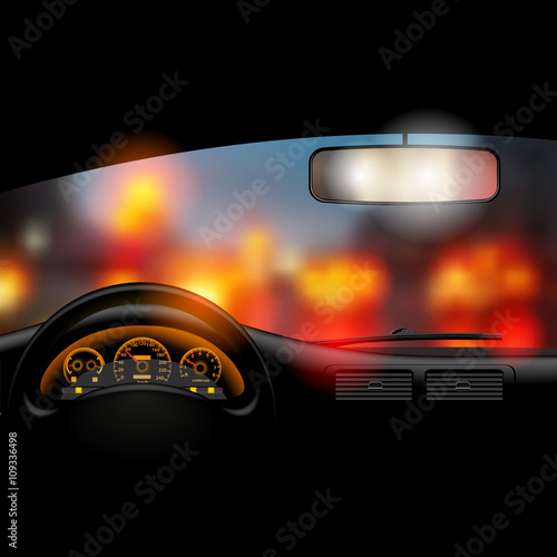 View from inside the car on the night city lights background