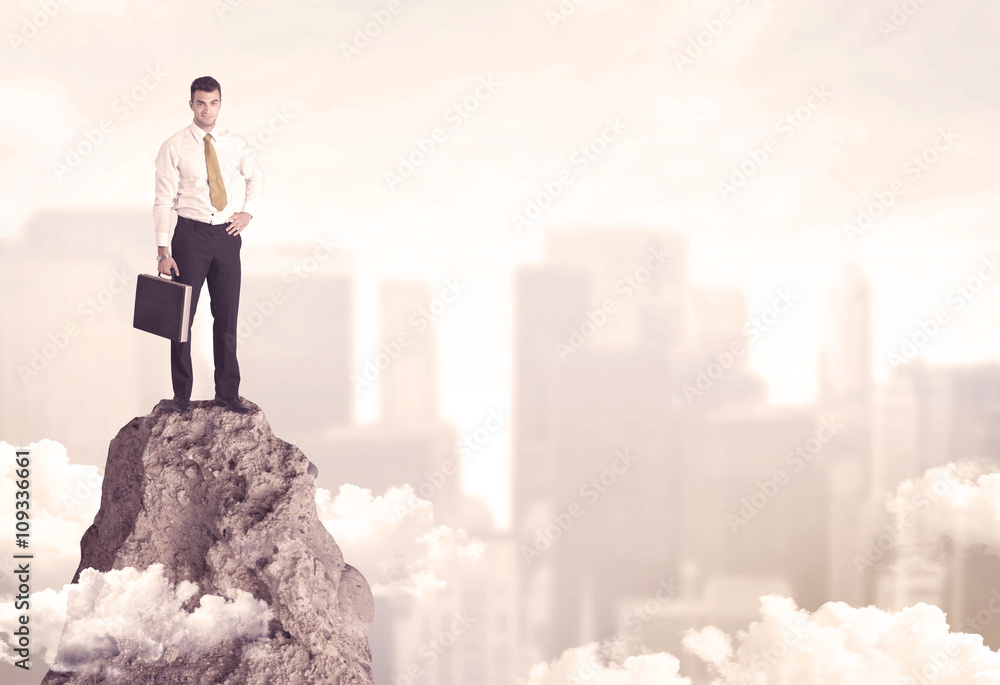 Confident businessman on dangerous cliff Confident businessman on dangerous cliff