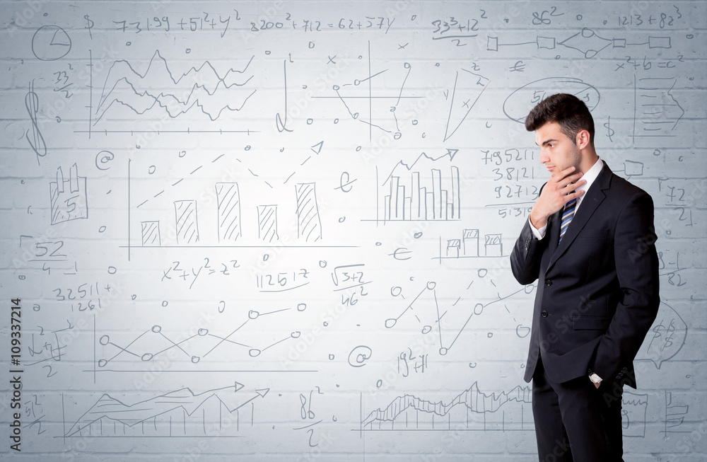 Salesman standing with drawn graph charts Salesman standing with drawn graph charts