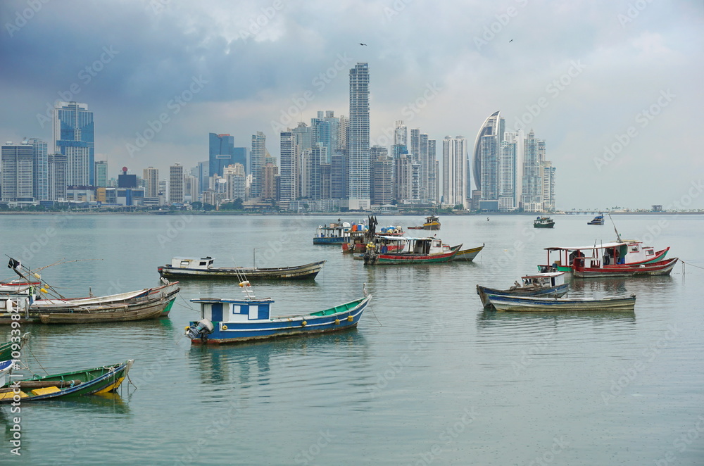Fishing boats anchored with skyscrapers of Panama City in background, Pacific coast, Central America