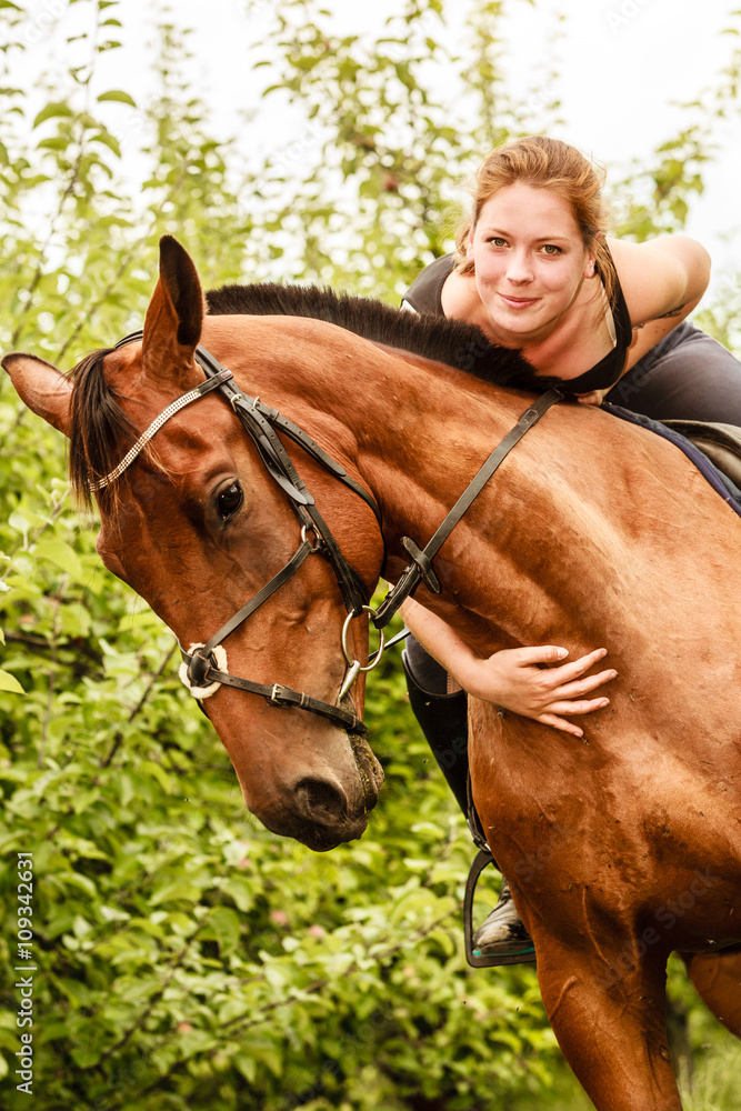 Fototapeta premium Woman jockey training riding horse. Sport activity