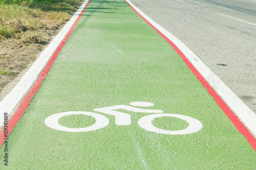 Bicycle path drawn on the asphalt road. Lanes for cyclists. Traffic signs and road safety