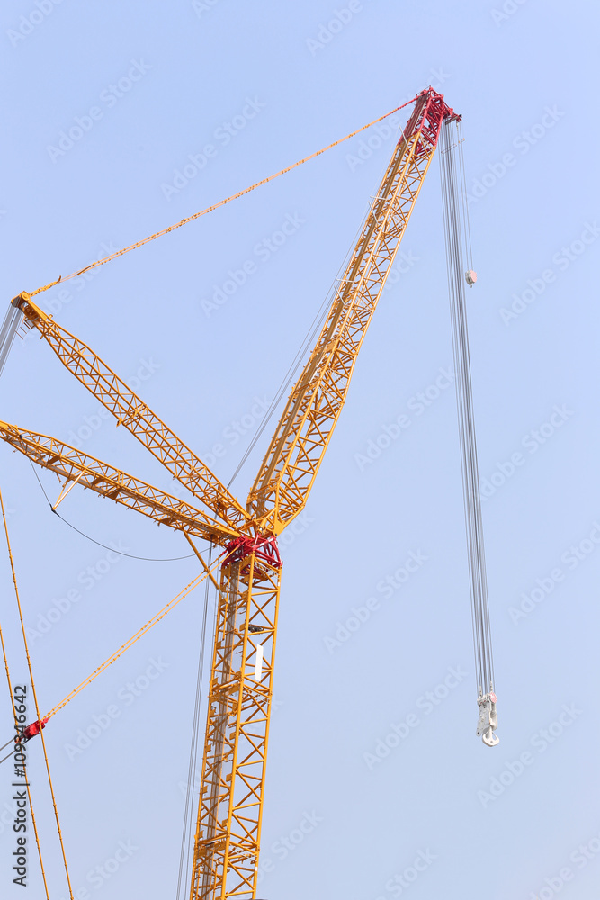 big crane on blue sky background. big crane on blue sky background.