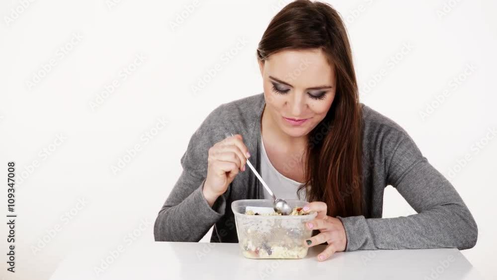 Woman eat oatmeal with dry fruits. Dieting 4K. Woman eat oatmeal with dry fruits. Dieting 4K.