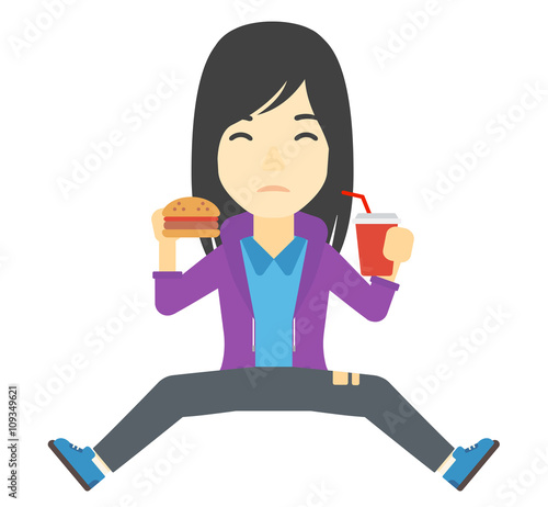 Woman eating hamburger. 