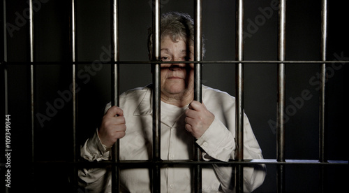 Elderly woman behind bars in jail