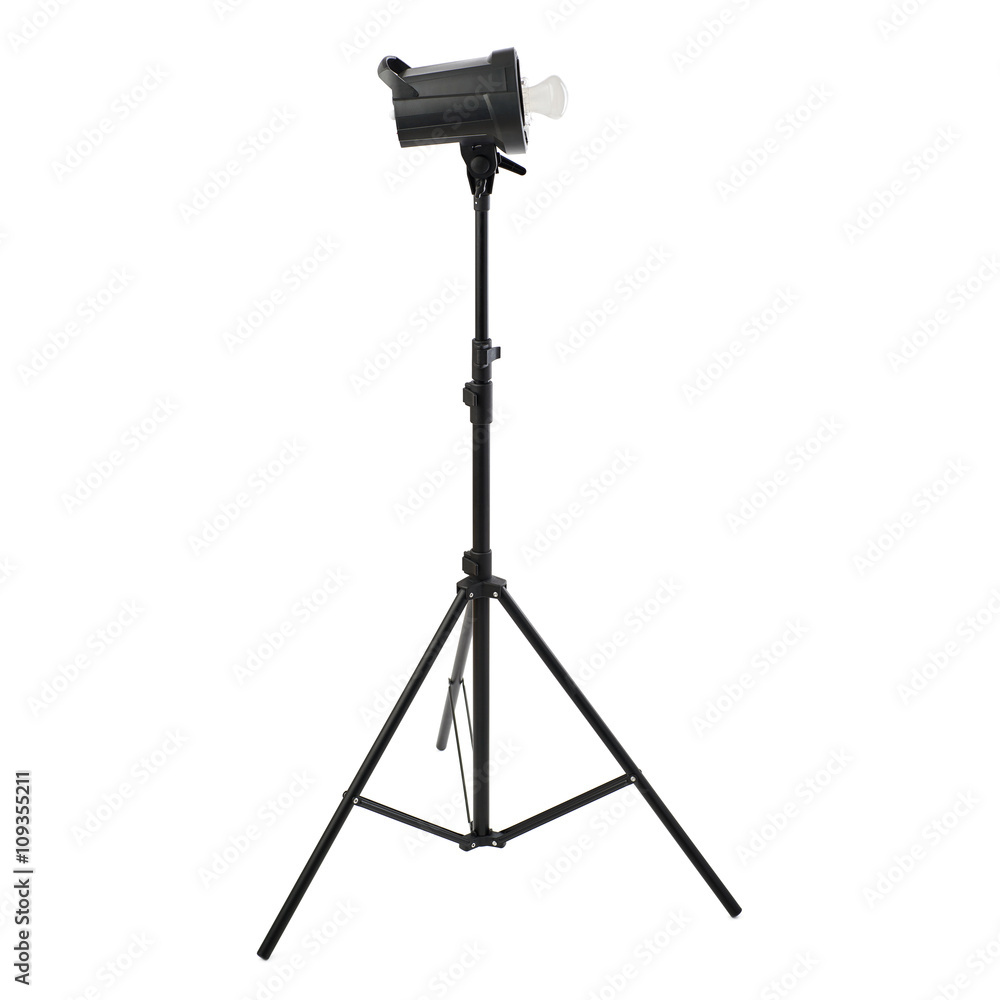 Studio flash on a stand over isolated white background Studio flash on a stand over isolated white background