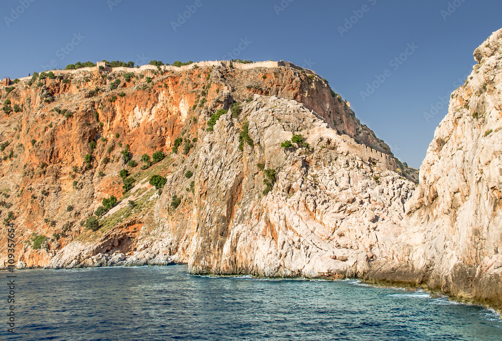 Ancient Alanya fortress on a high rock by the sea