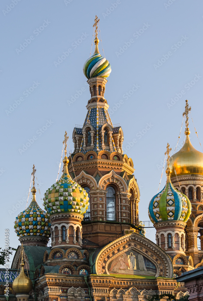 View of the domes and the bell tower, the 19th century Church of the Savior on blood in St. Petersburg, on the background of blue sky. Summer 2015.