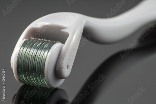 Derma roller for medical micro needling therapy. Tool also known as: Derma roller, mesoroller, meso-roller, mesopen. photo
