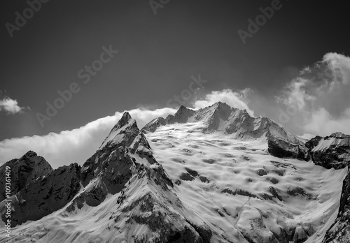 Black and white Caucasus Mountains in cloud