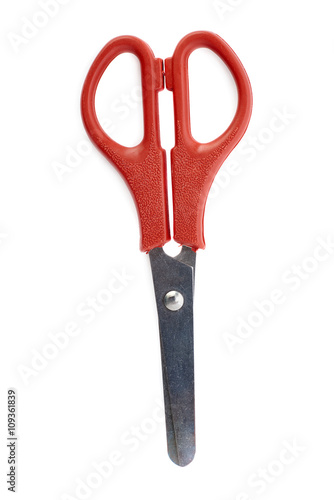 Red scissors isolated over the white background