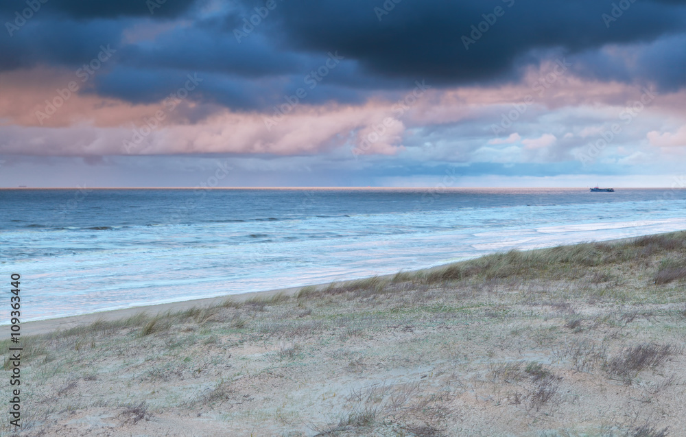 rainy sundown over north sea coast