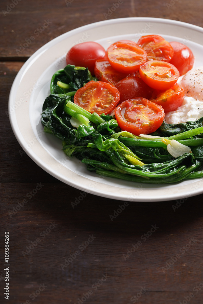 tomato and spinach salad with egg. tomato and spinach salad with egg.
