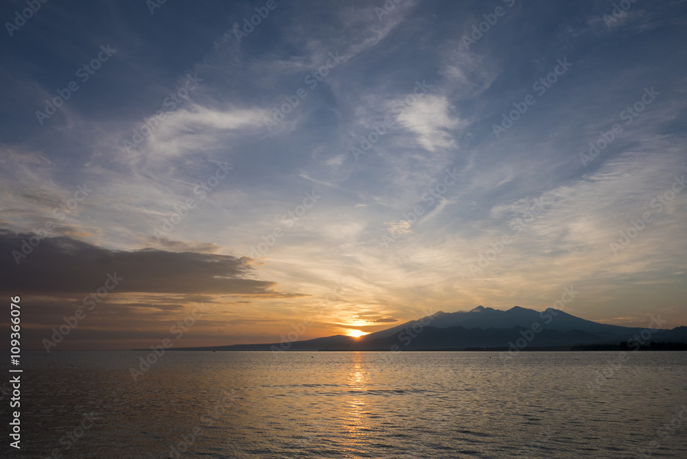 Awesome sunrise and still water on Gili Air Island, Indonesia Awesome sunrise and still water on Gili Air Island, Indonesia