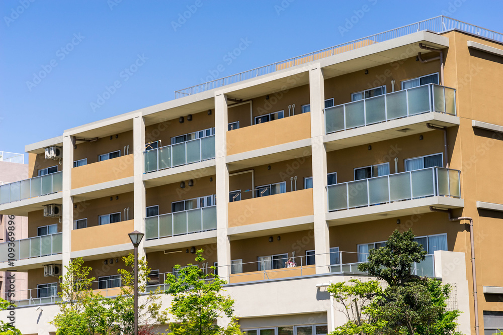Fototapeta premium Apartment building in Japan, against blue sky