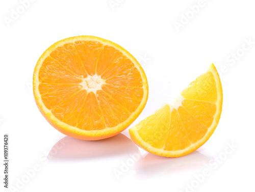 Orange cut pieces on white background.