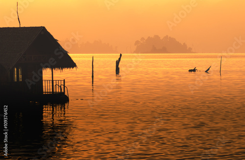 silhouette home stay on lake orange tone