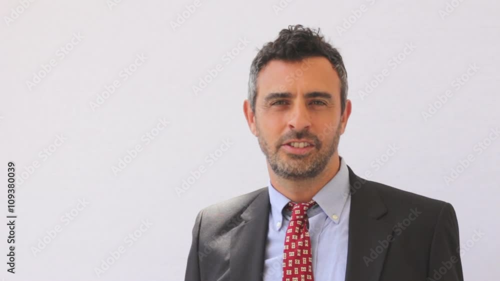 Smiling business man with yes and no gestures Smiling business man with yes and no gestures