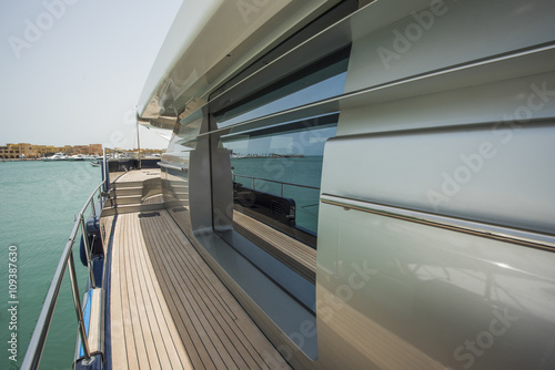 Side of a luxury yacht with panorama window