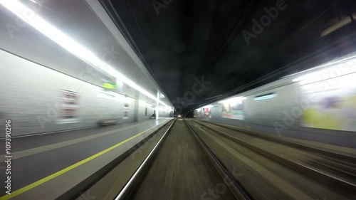 4K footage of a Vienese Underground tram going along its rail photo