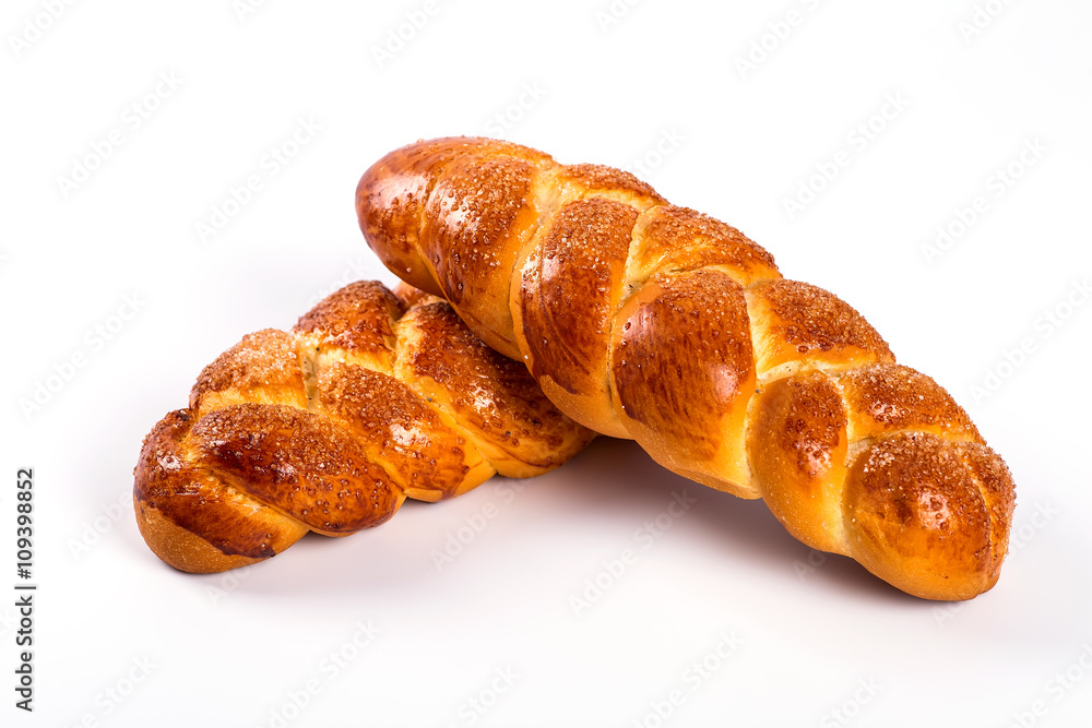 pile of fresh and delicious kroissants and rolls on a white back