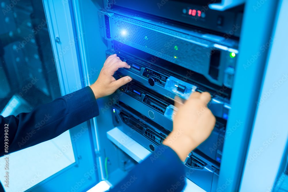 Man fix server network in data center room Man fix server network in data center room
