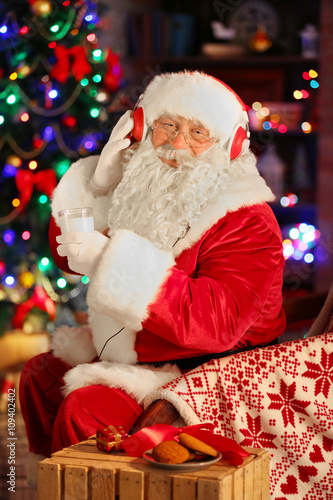 Santa Claus sitting with he...