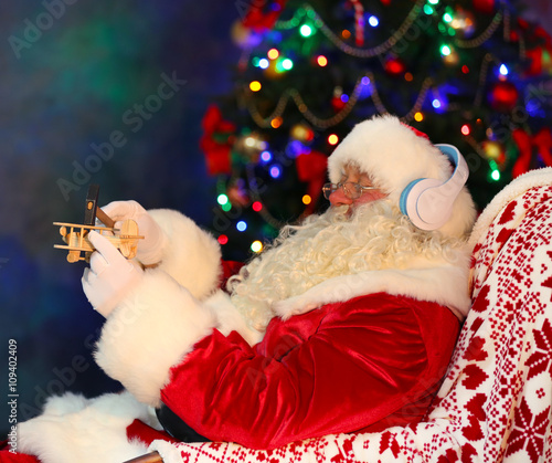 Santa Claus sitting with he...