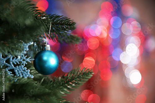 Christmas tree with decor on bright background  closeup