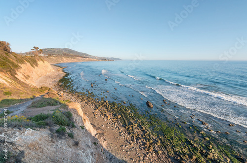 California Ocean Cliffs.  A cliff view of the Pacific ocean at low tide in Carpinteria, California. photo