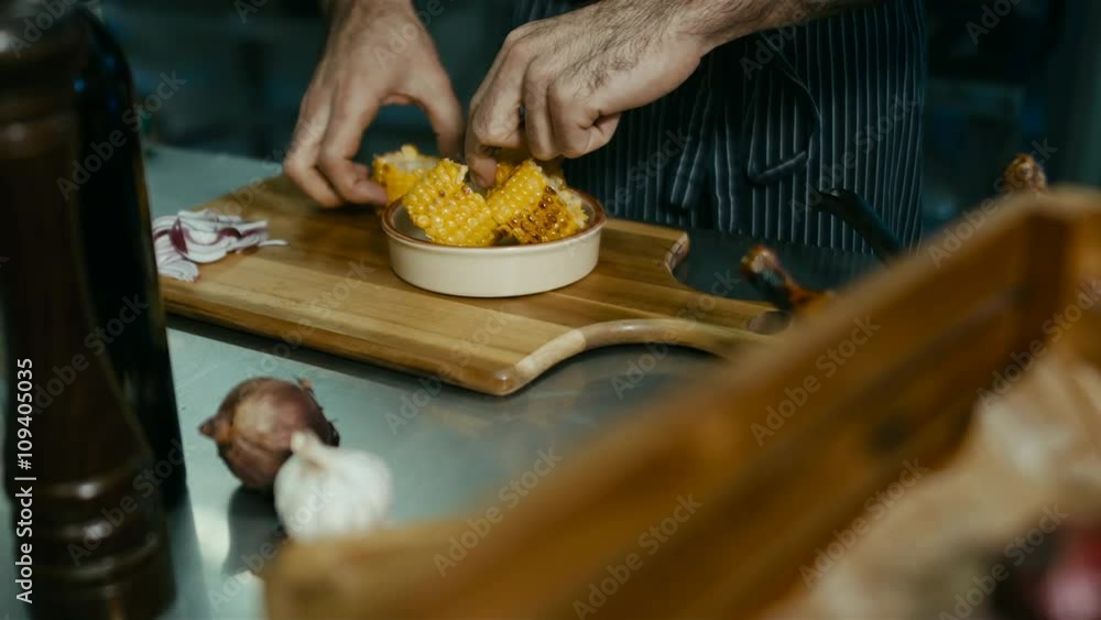 Chef preparing corn for serving. 60 FPS slow motion shot. Blackmagic URSA Mini Chef preparing corn for serving. 60 FPS slow motion shot. Blackmagic URSA Mini