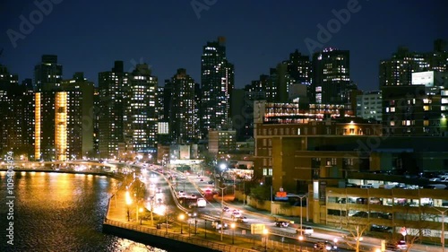 East Harlem neighborhood skyline with rush hour traffic on FDR drive, at night, in Manhattan, New York City photo