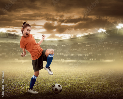 Happy woman soccer player © Leo Lintang
