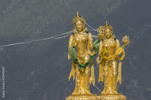 Statues of buddhist goddesses at top hill in Kuenselphodrang Nature Park, Thimphu, Bhutan - Goddesses statues at Buddha Dordenma site