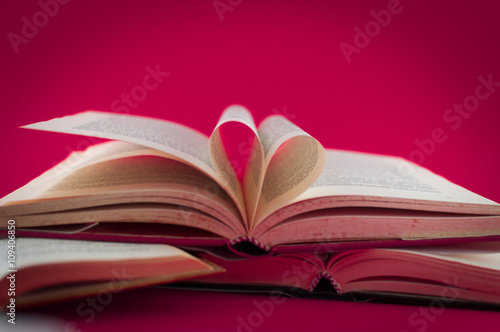 closeup of open books on colored background