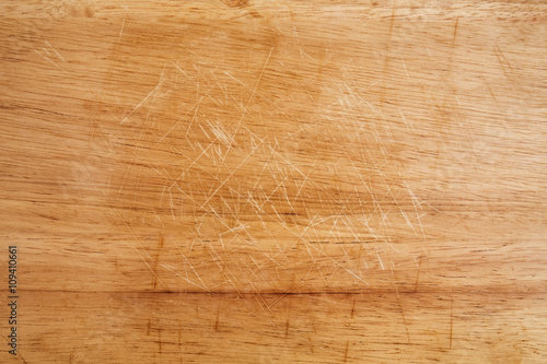 Fotografie Old scratched wooden chopping board texture