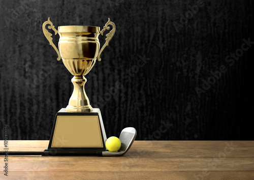 champion golden trophy on wood table with Golf clubs and golf ba