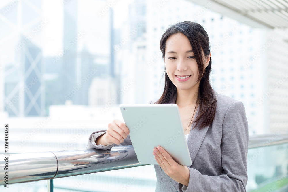 Businesswoman working on tablet computer